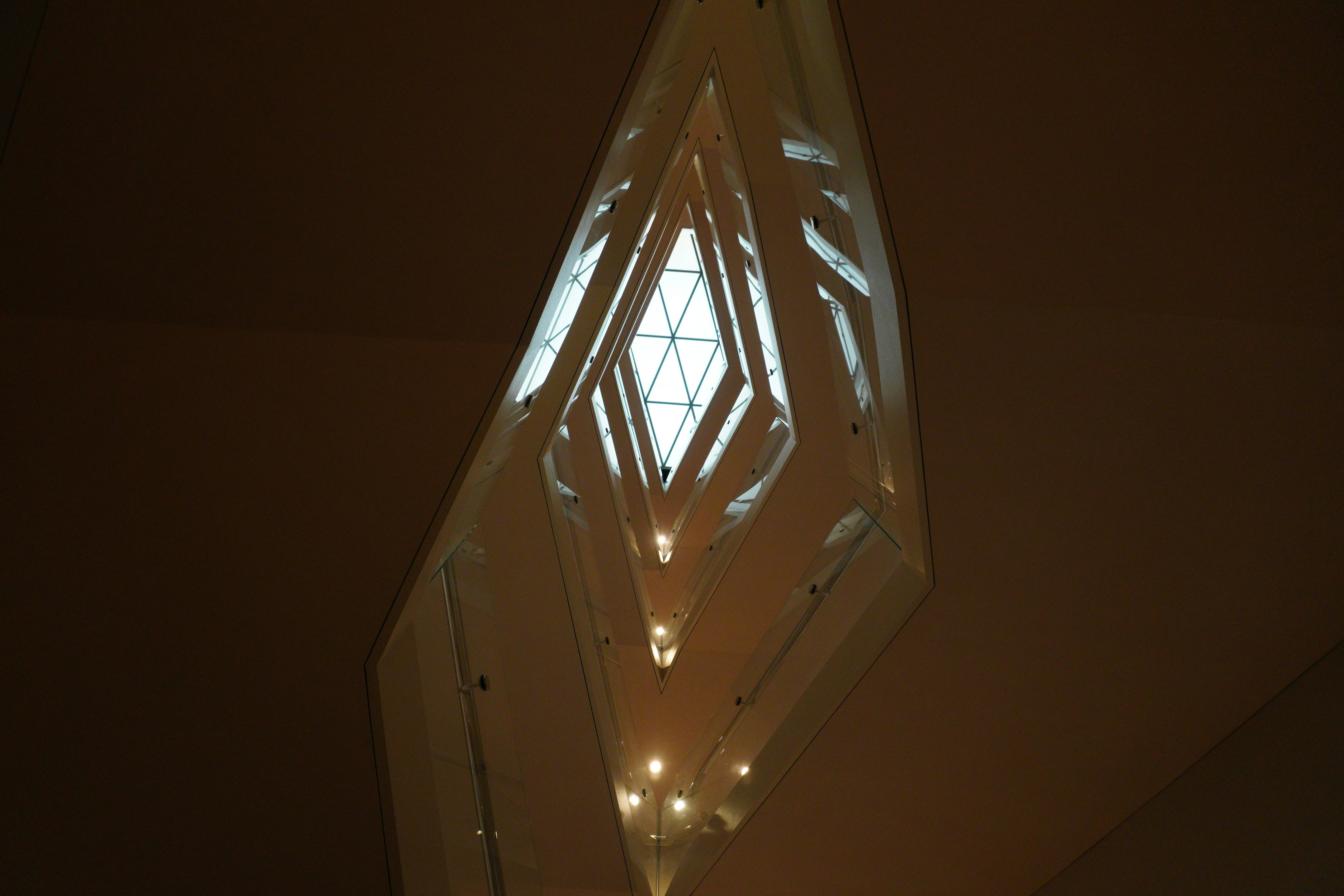 a light fixture hanging from the ceiling of a building