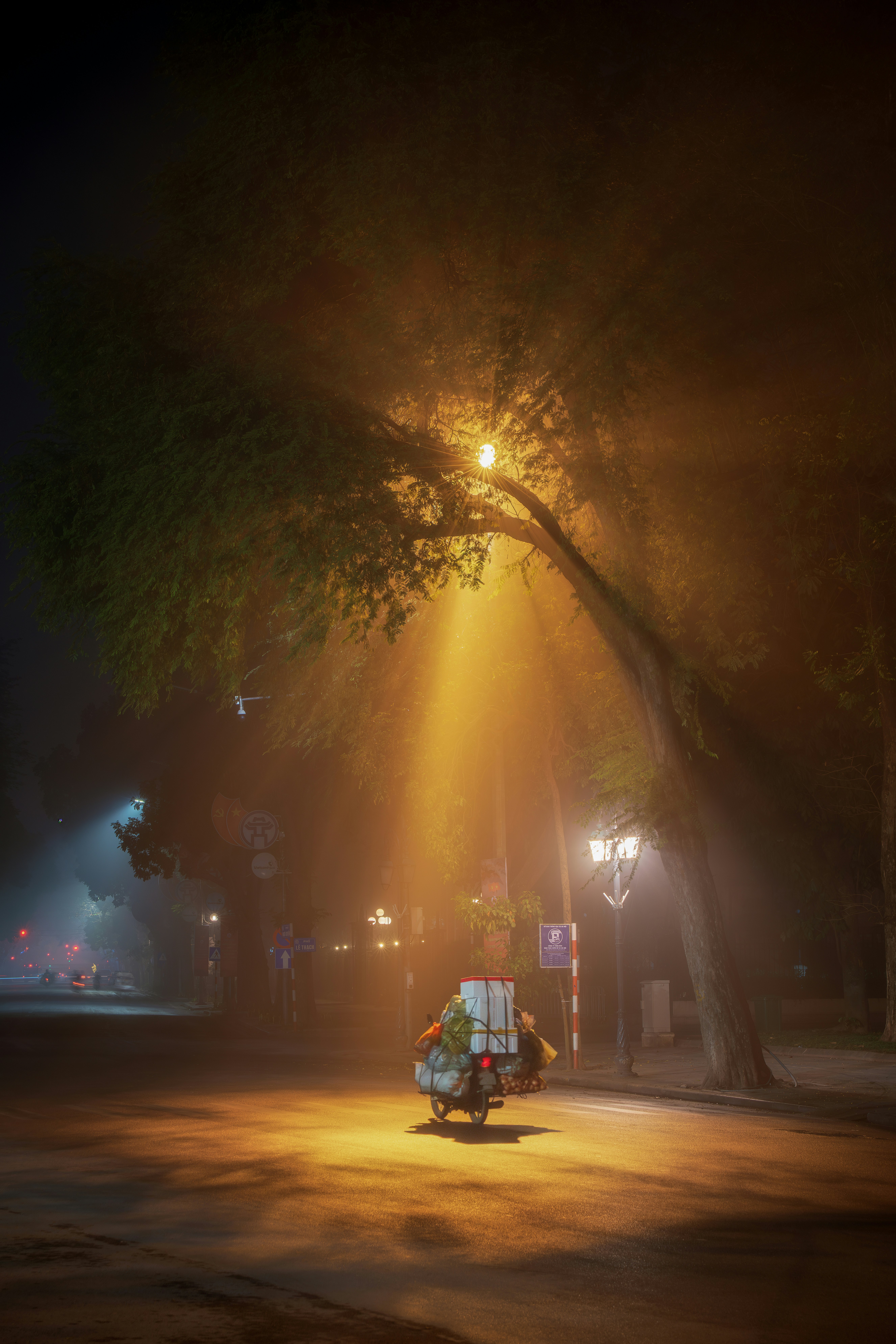 a motorcycle parked on a street at night