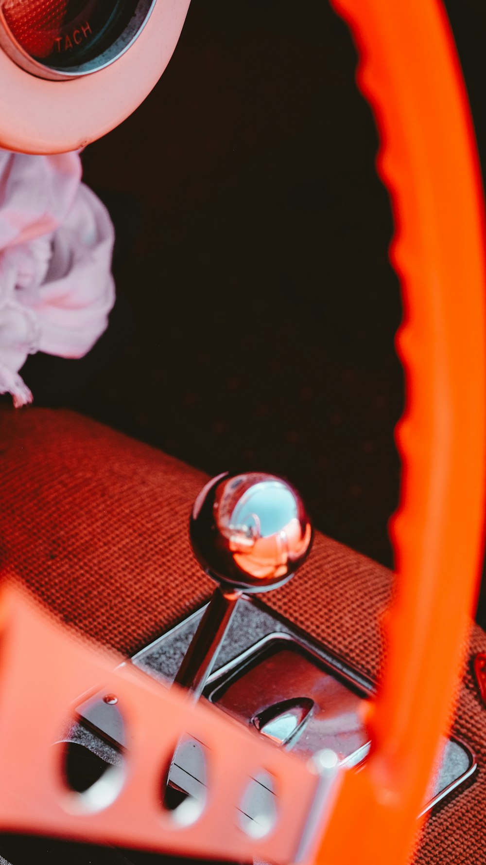 a close up of a steering wheel and a mirror