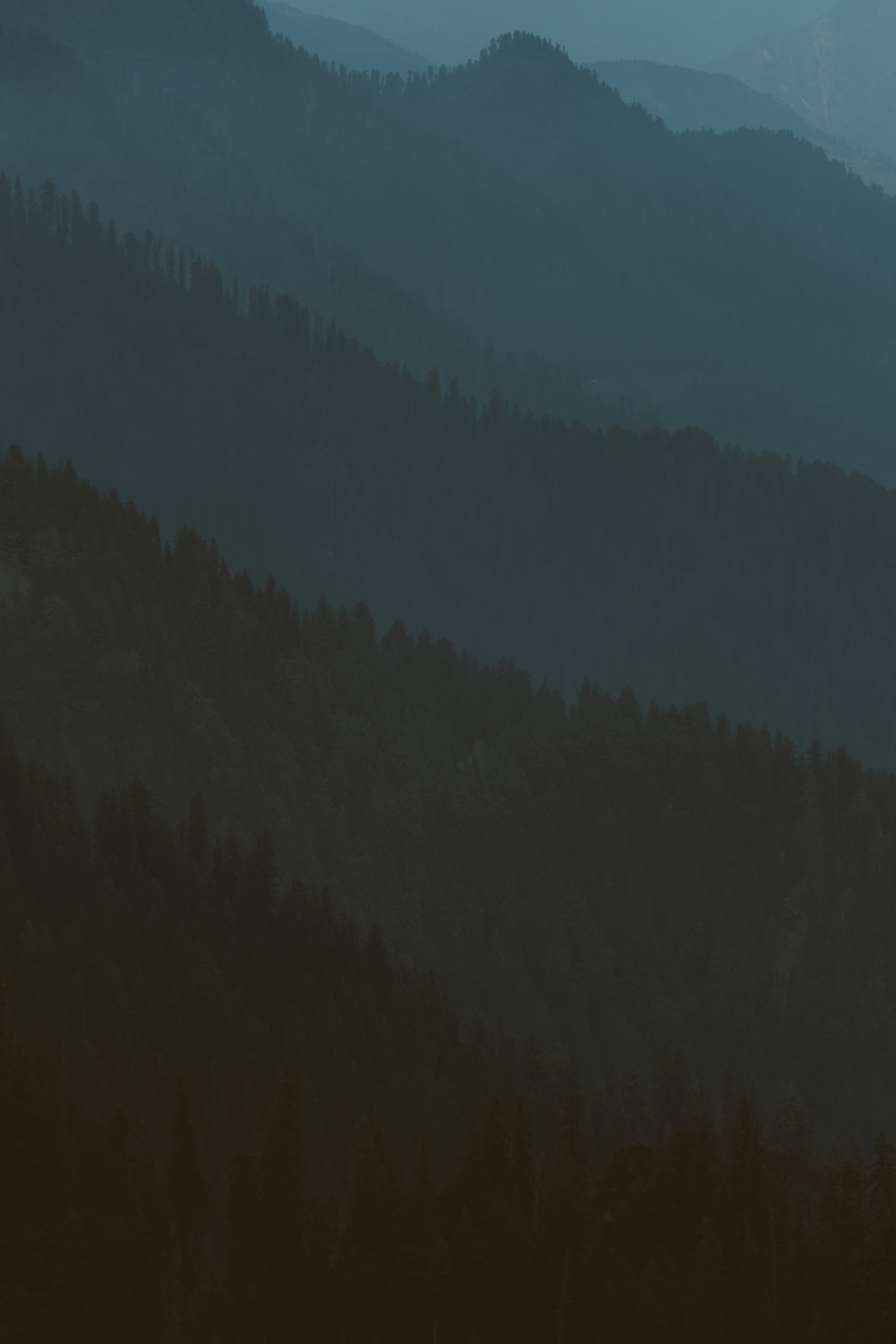 Layers of mountains on a foggy morning as seen from Jalori Pass, HP, India.