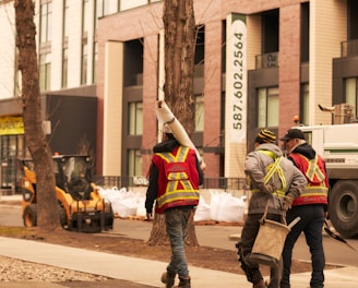 a group of men walking down a street