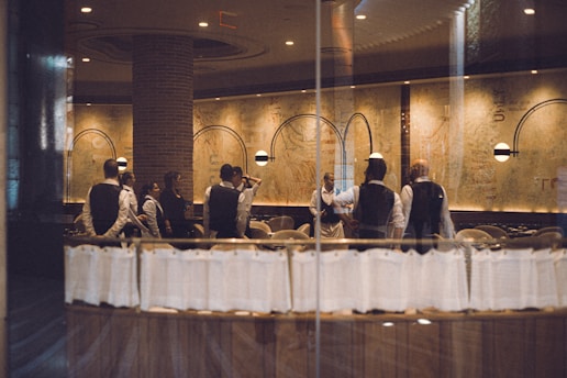 a group of people sitting at a table in a restaurant