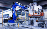 blue industrial robot arm in factory