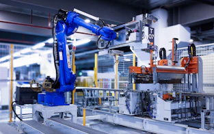 blue industrial robot arm in factory