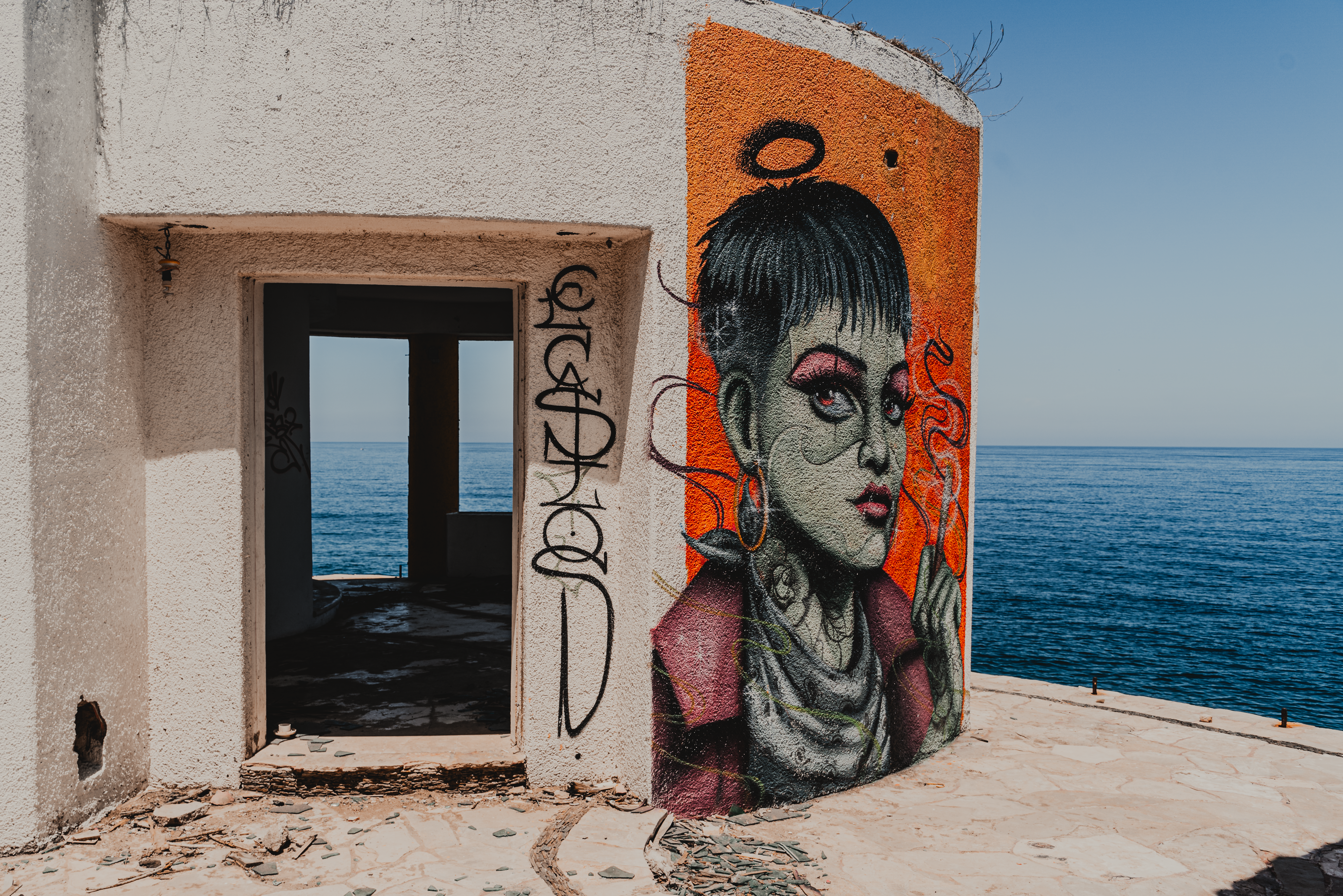 a painting of a woman on the side of a building