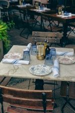 a table with plates and napkins on it