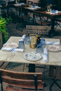 a table with plates and napkins on it