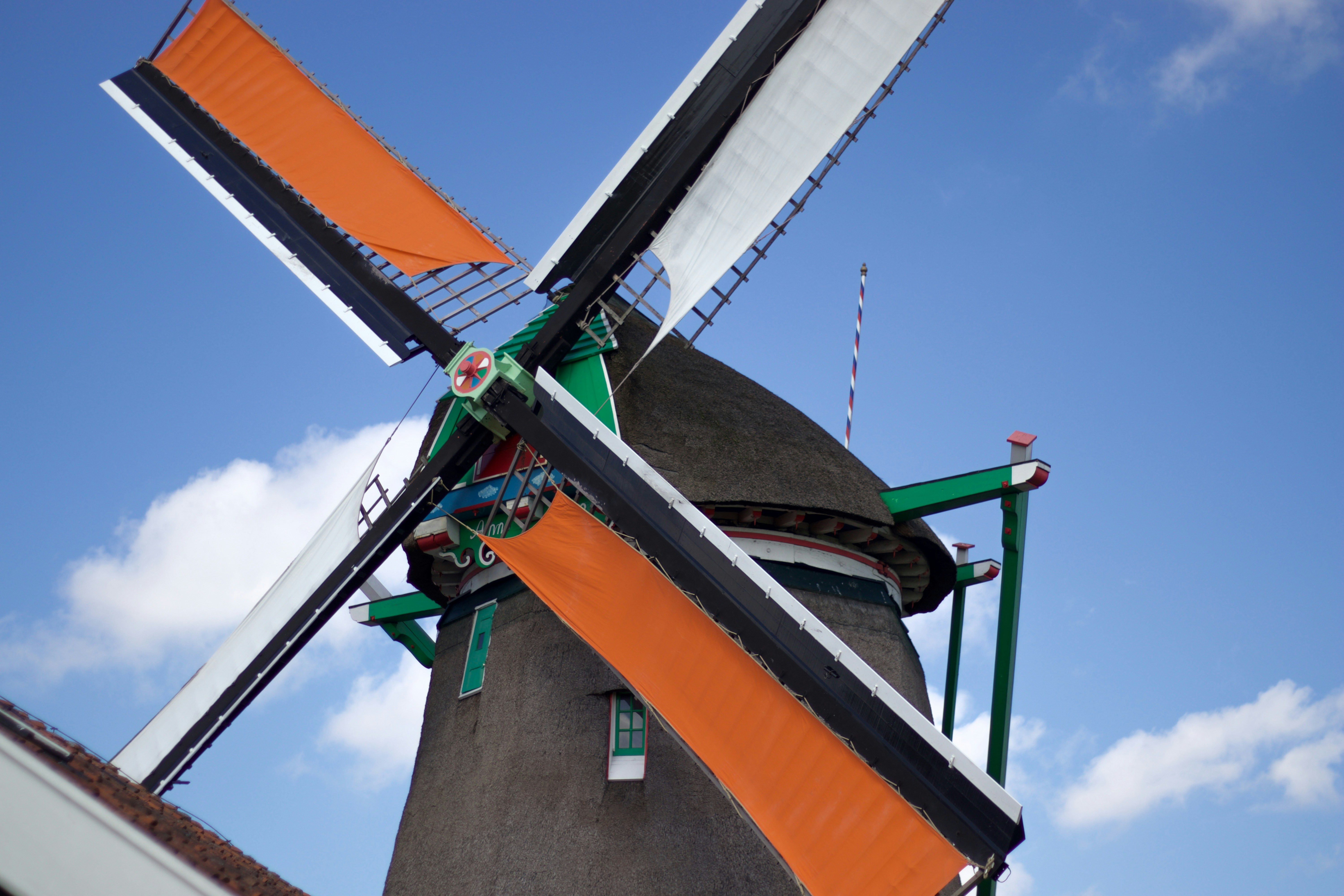 a windmill with a flag on top of it