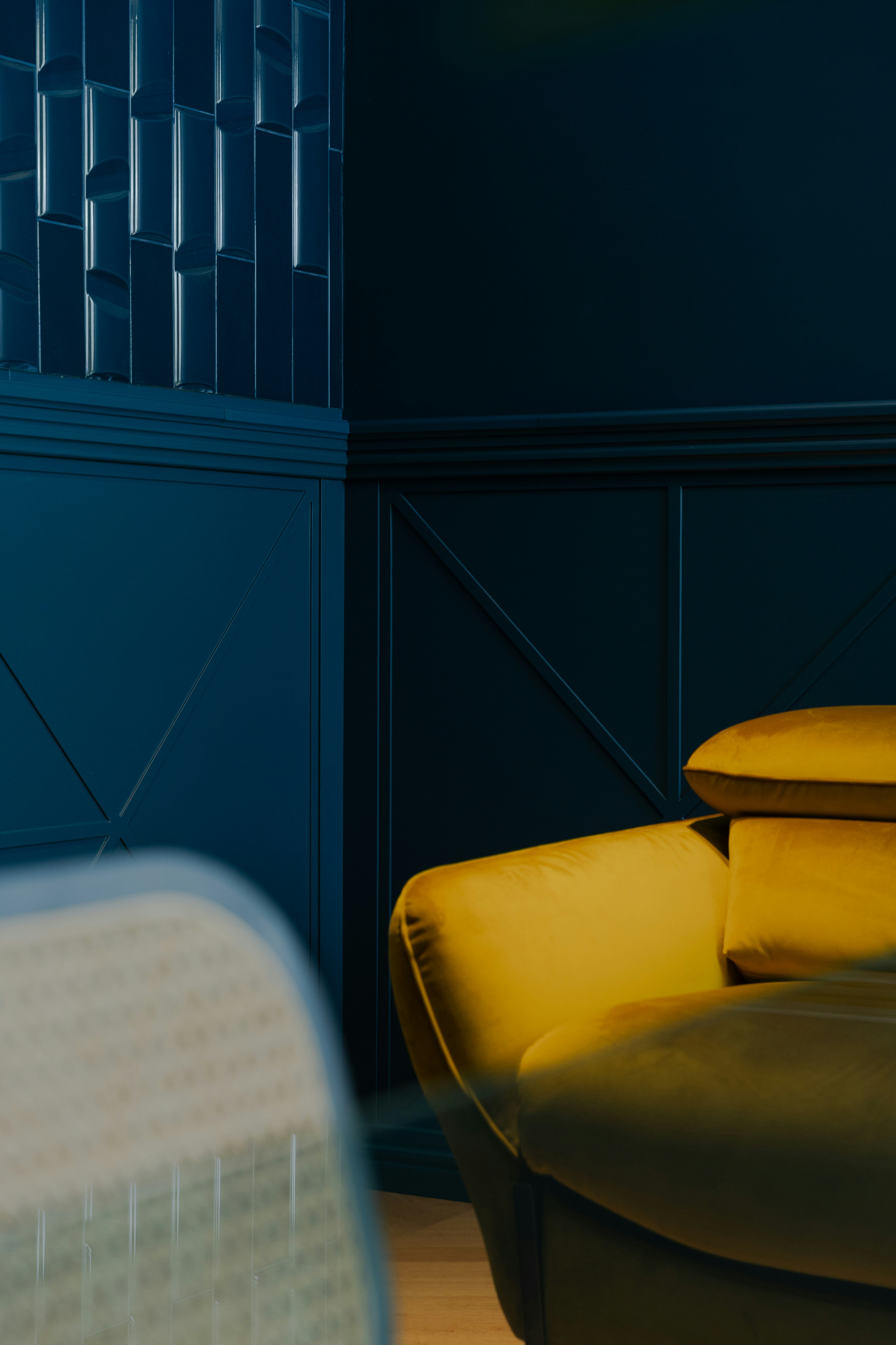 a living room with a couch and a chair