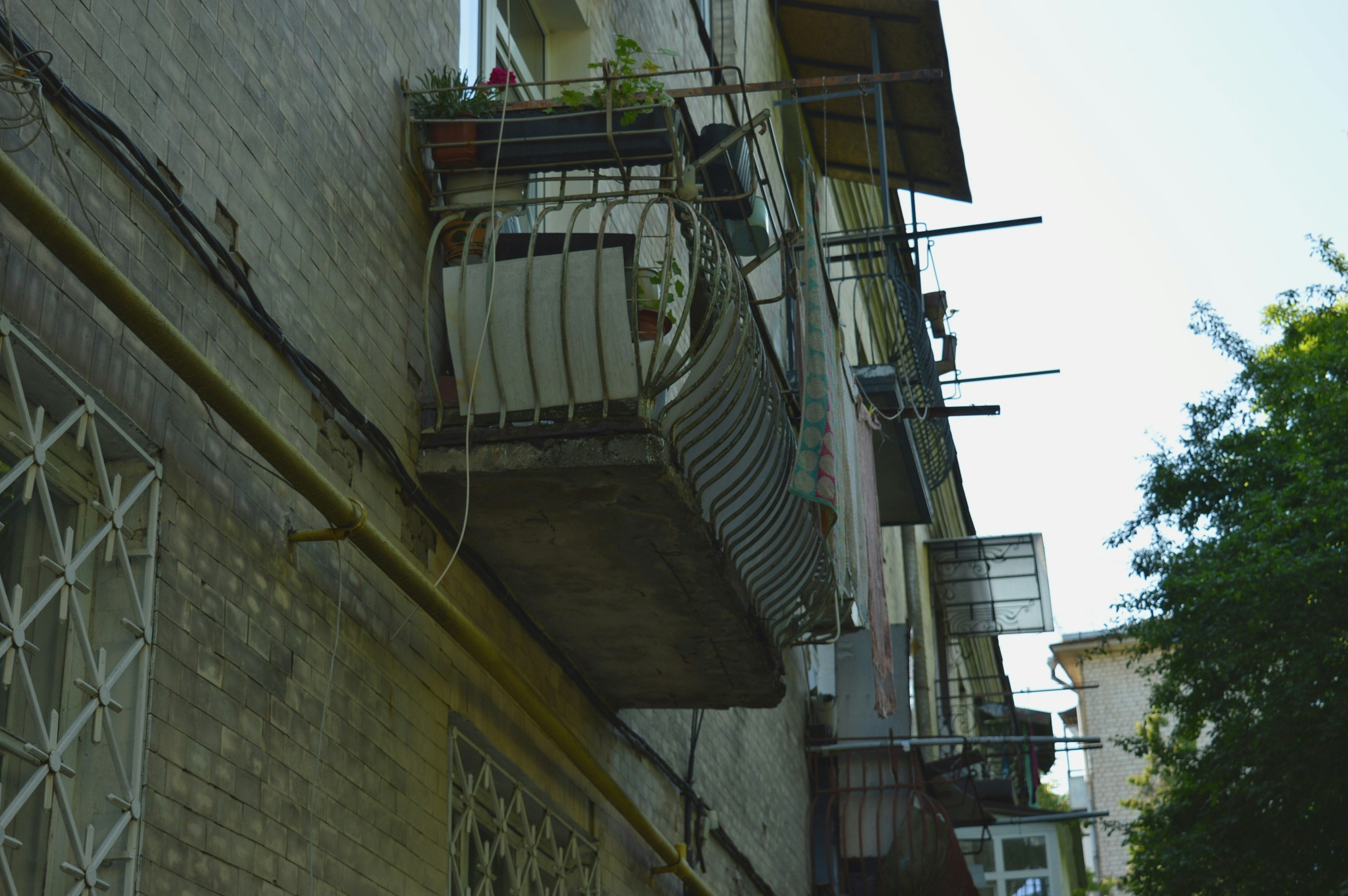 a building with a window and a balcony attached to it