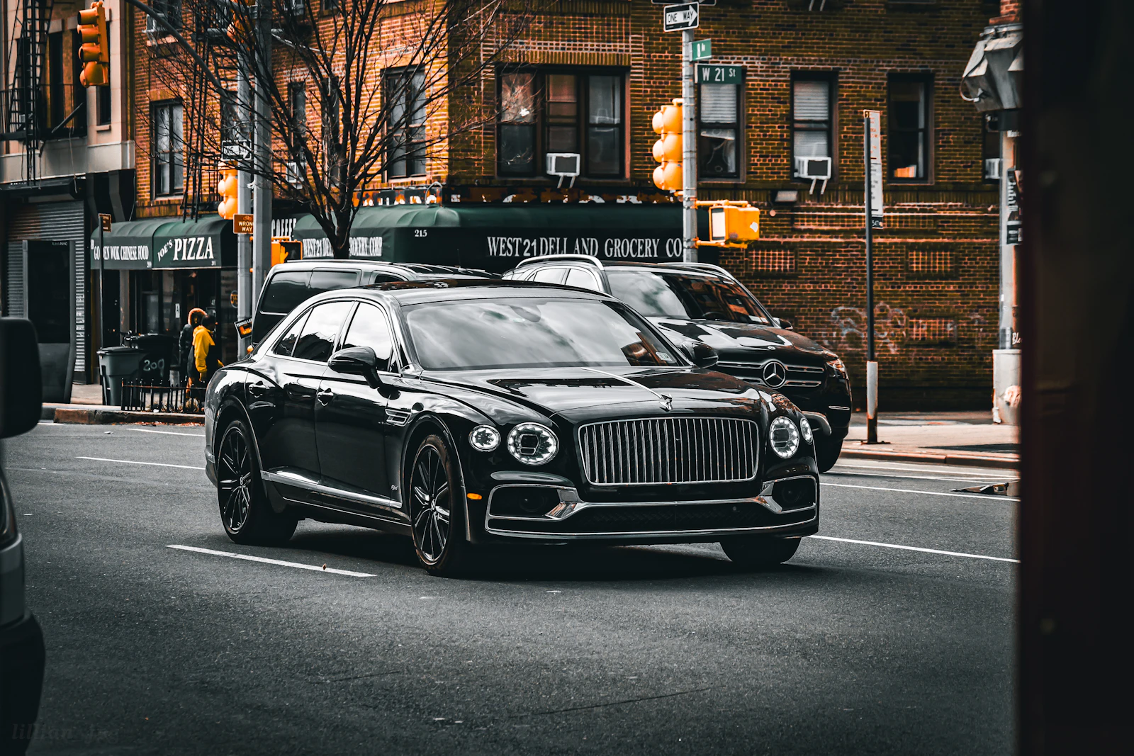 Black Bentley Flying Spur on a city street