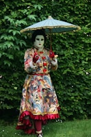 a woman in a costume holding an umbrella
