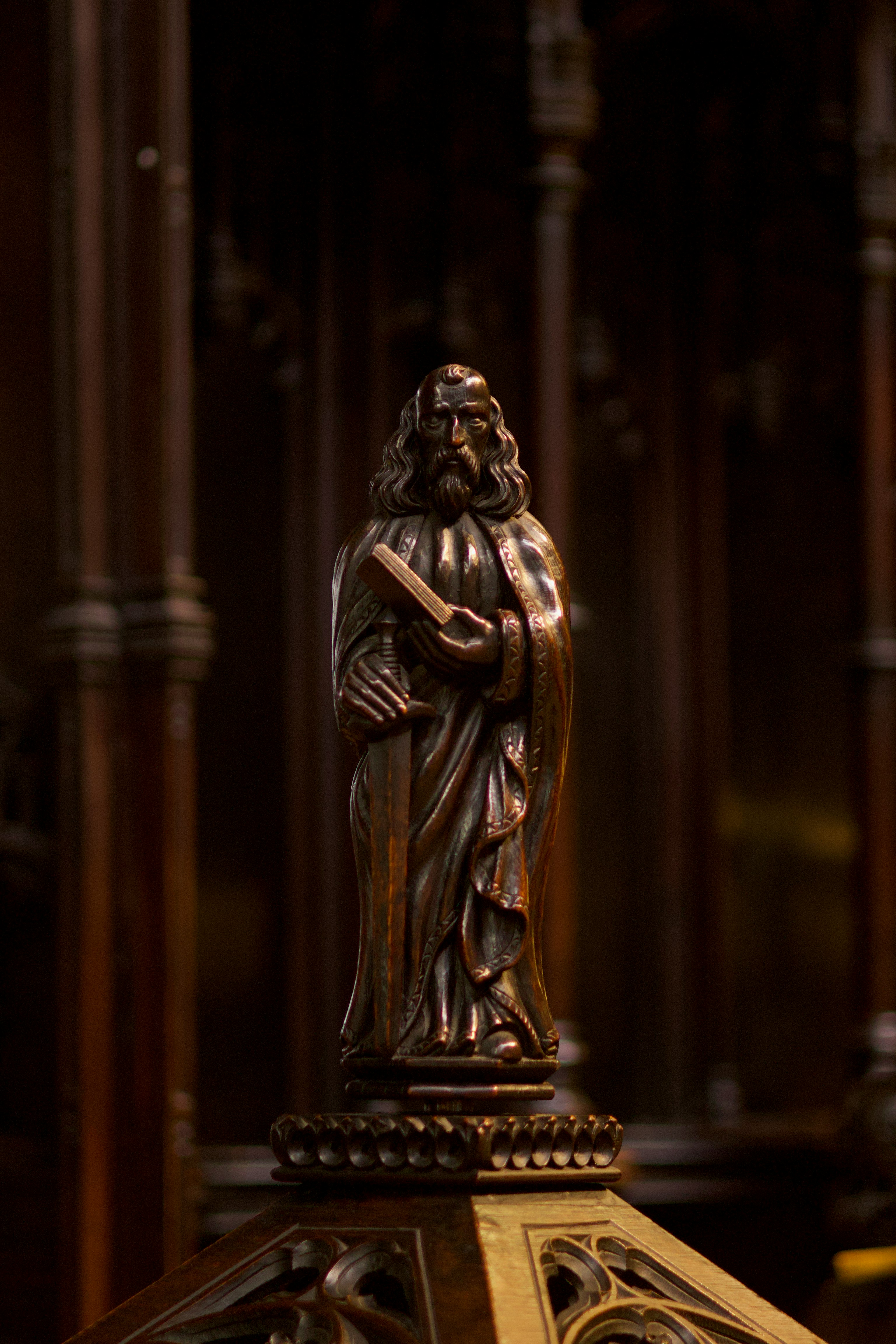 a bronze statue of a man with a beard