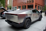 a futuristic car is parked on the side of the street