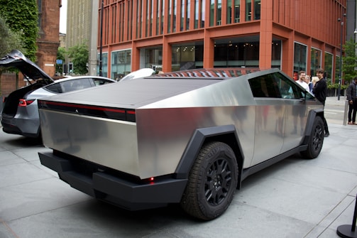 a futuristic car is parked on the side of the street