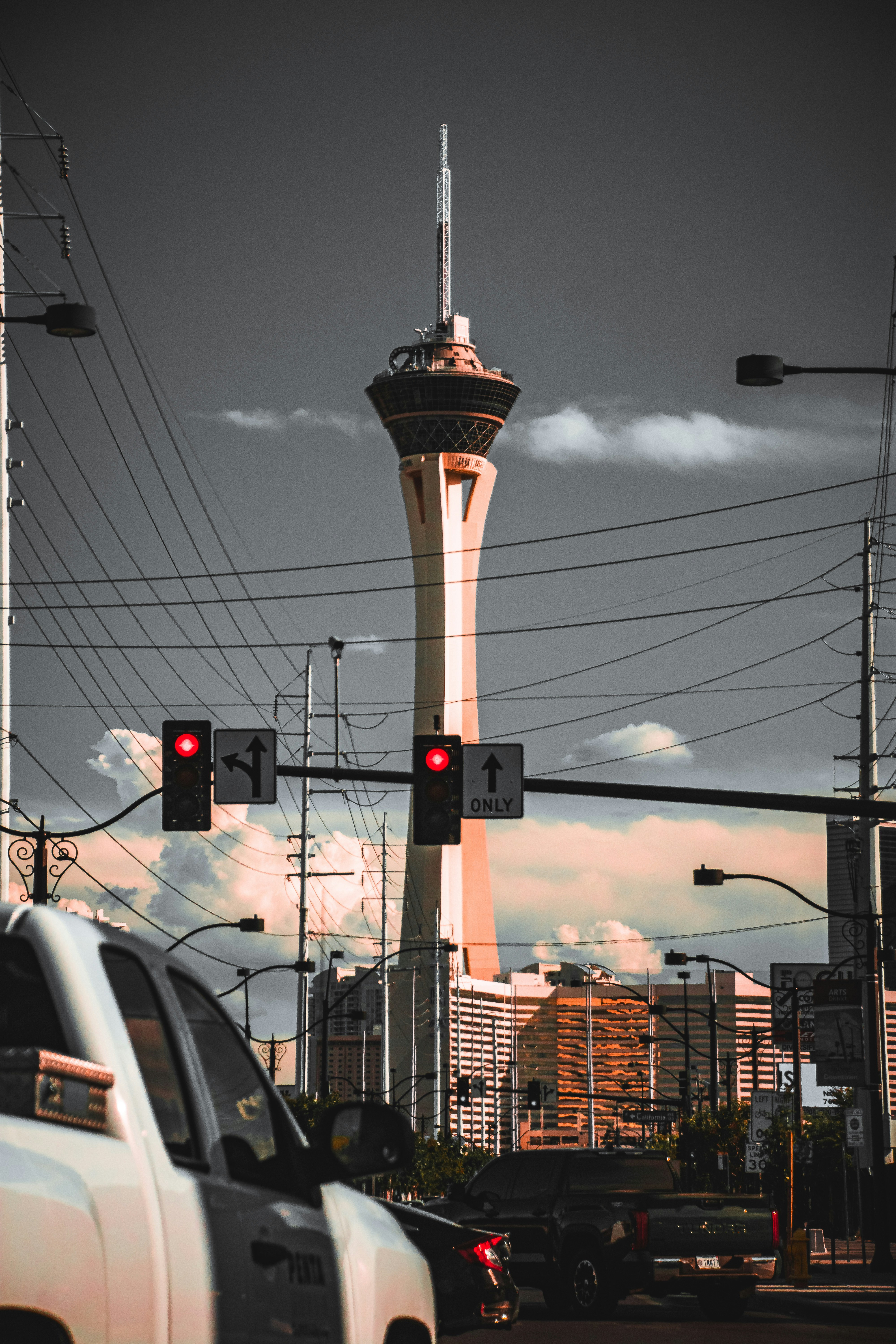 a traffic light with a tower in the background