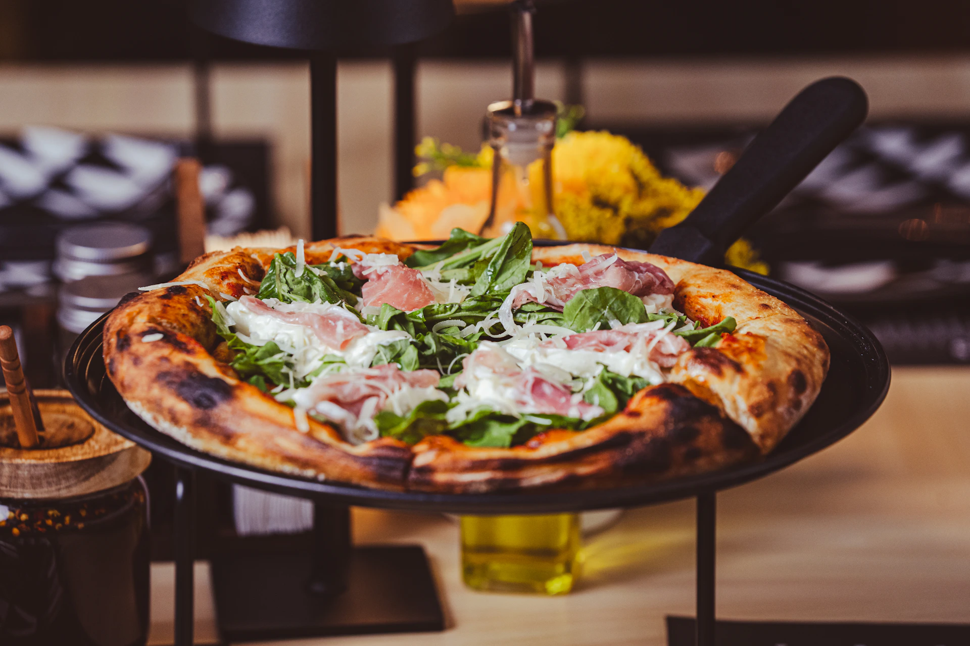 a pizza sitting on top of a pan on a table