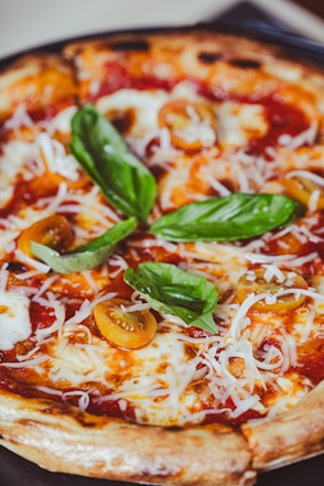 a close up of a pizza on a plate