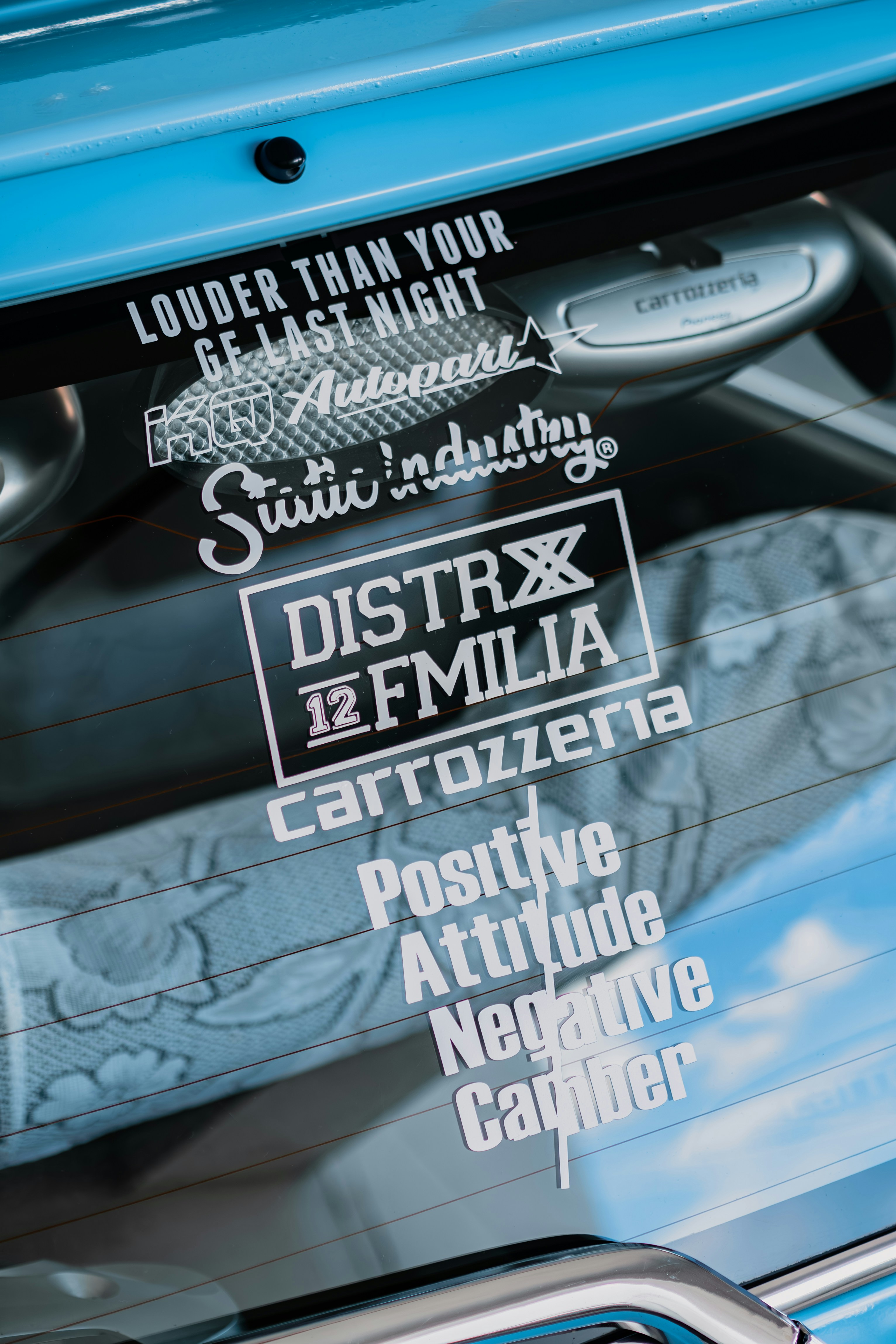 a close up of a car's windshield with stickers on it