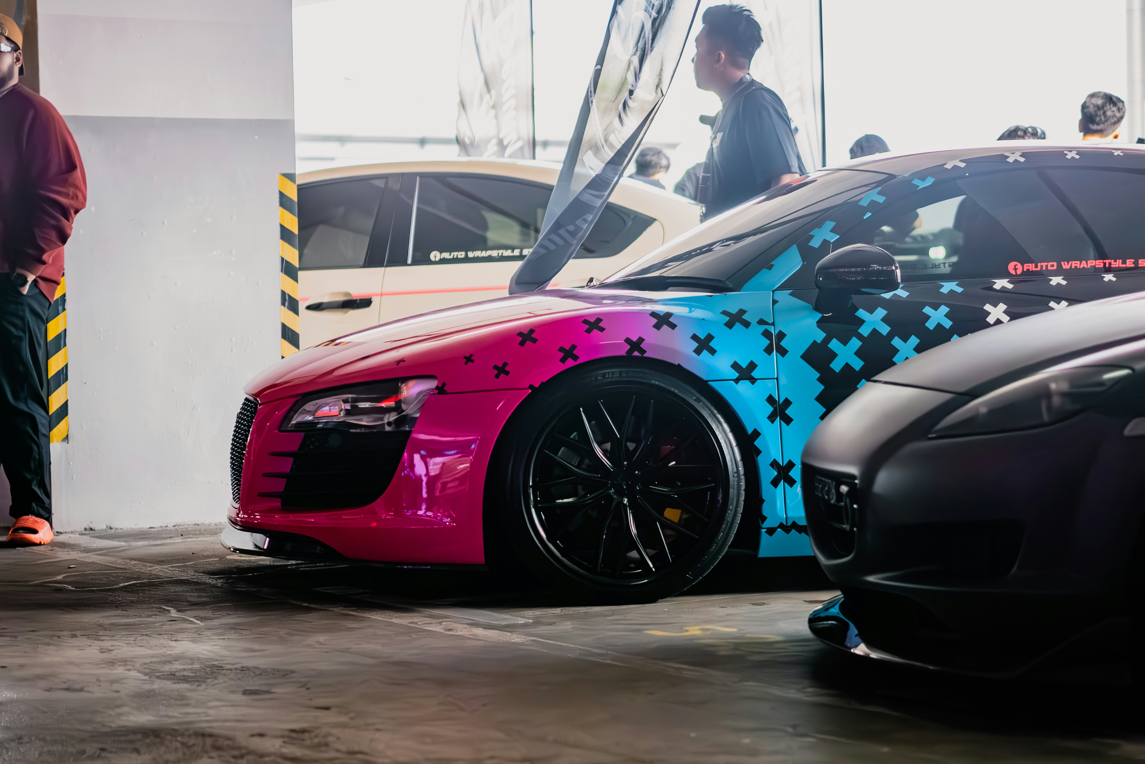 a couple of cars parked next to each other