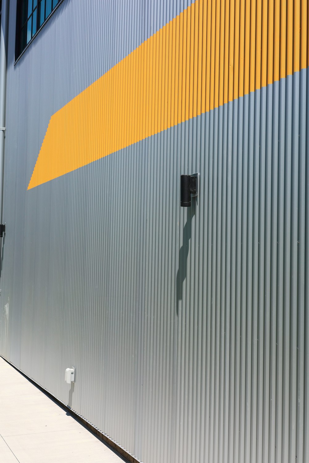 a building with a yellow and blue stripe on it
