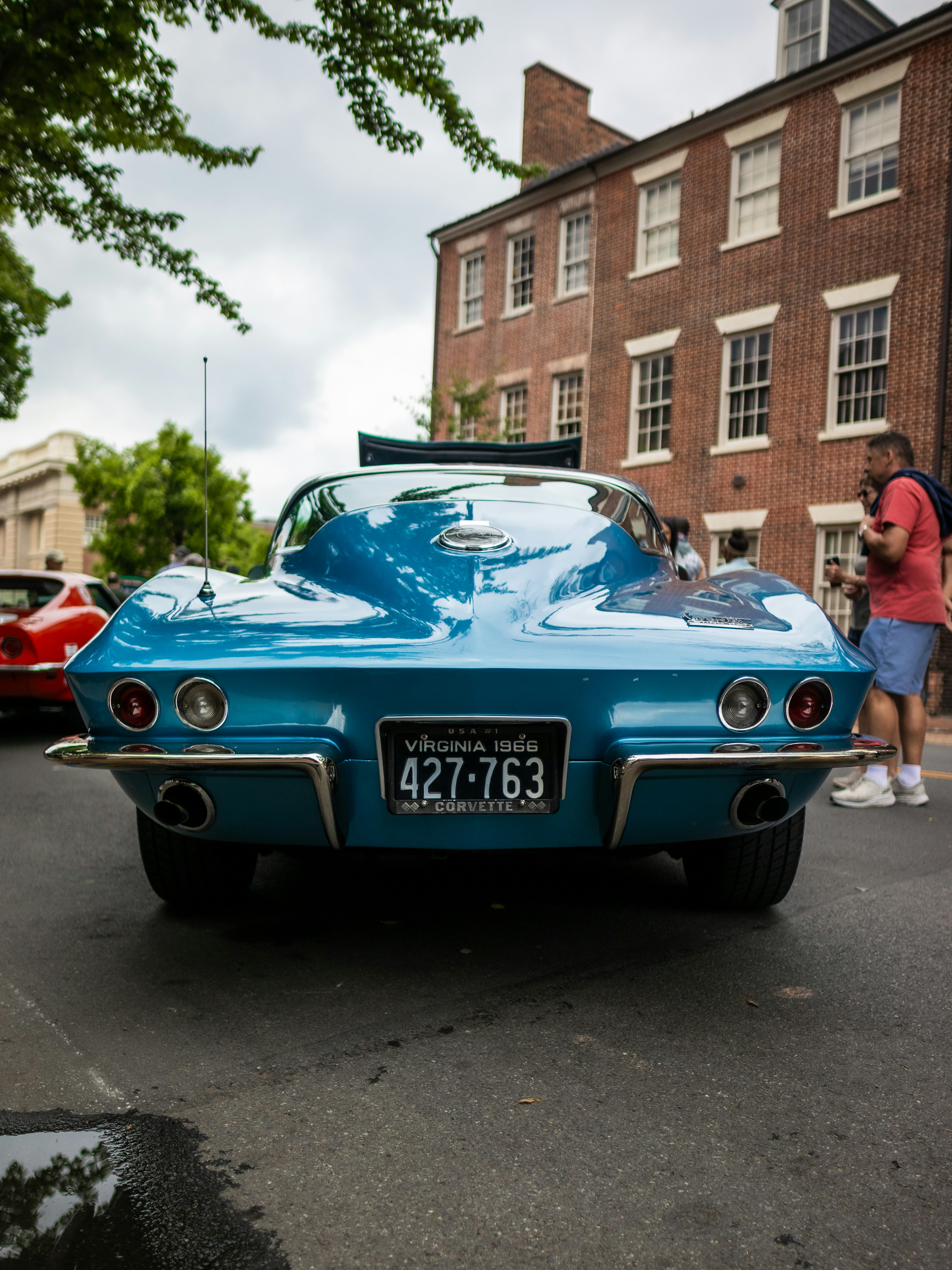 a blue car parked on the side of the road
