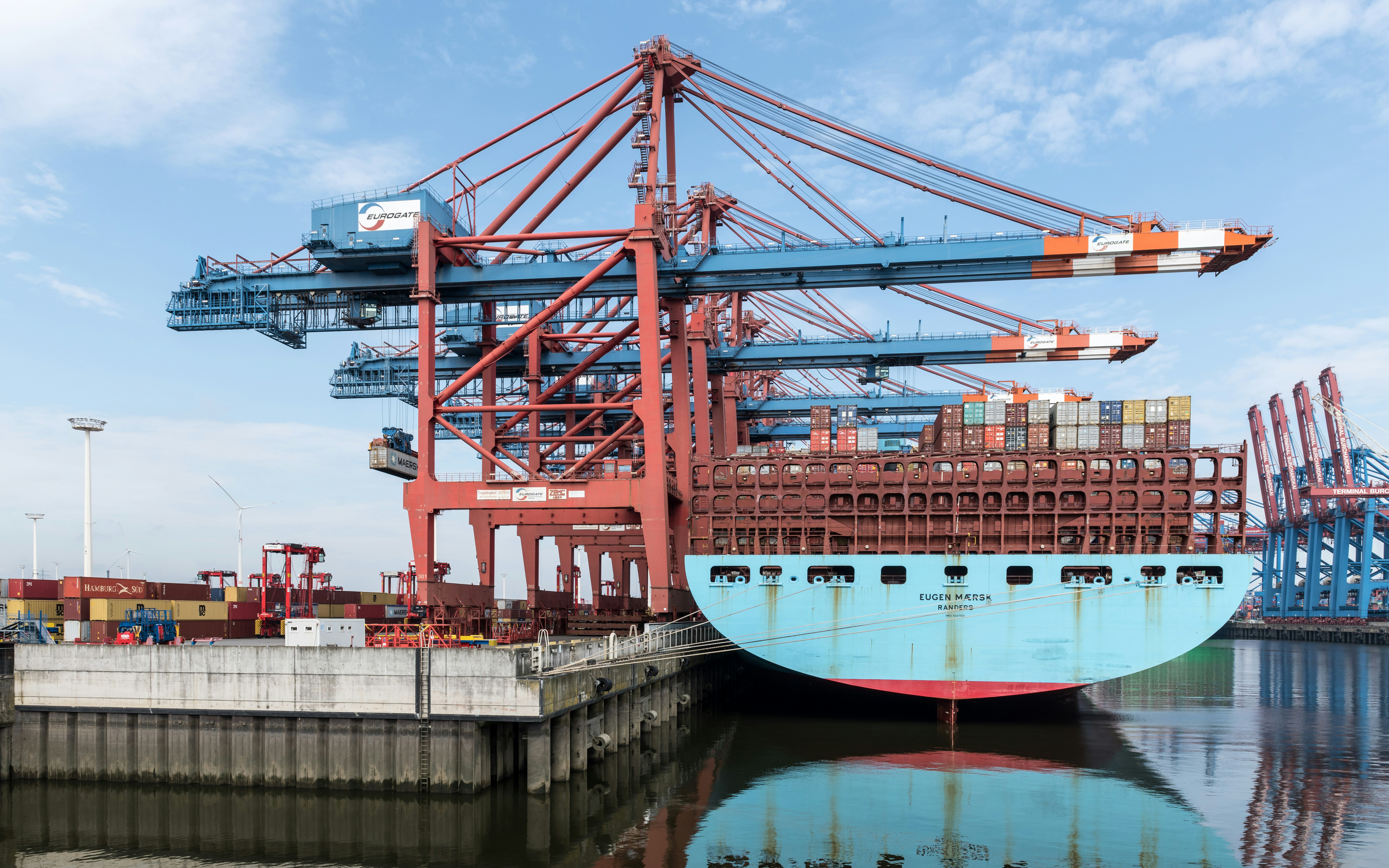 a large blue and red boat in a body of water
