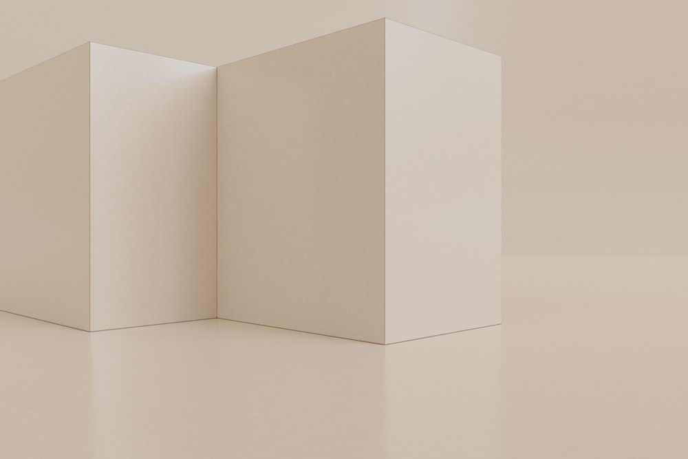 a pair of white boxes sitting on top of a white floor
