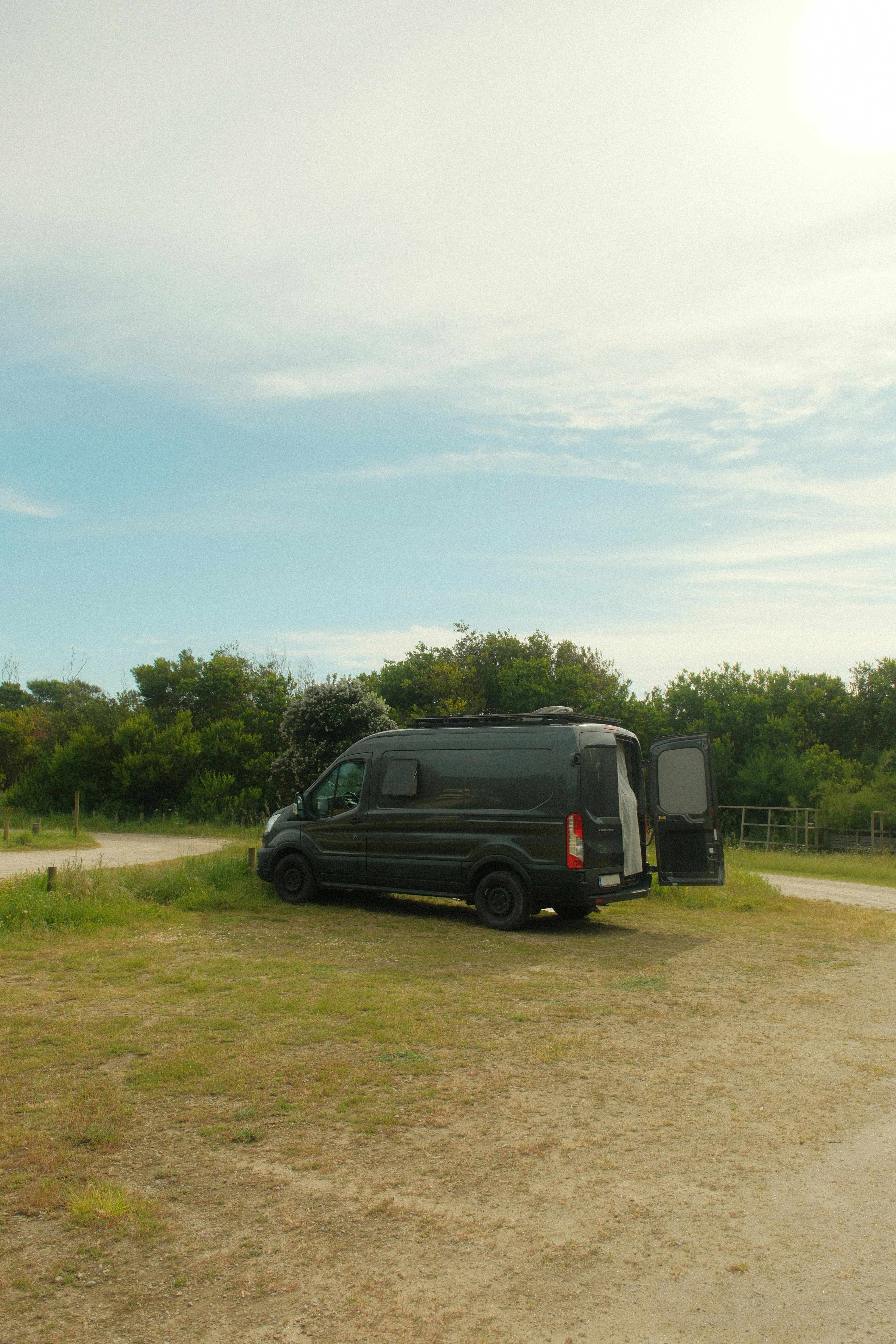 a van is parked on the side of the road
