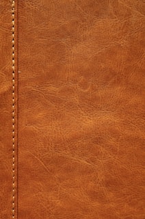 a close up of a brown leather texture