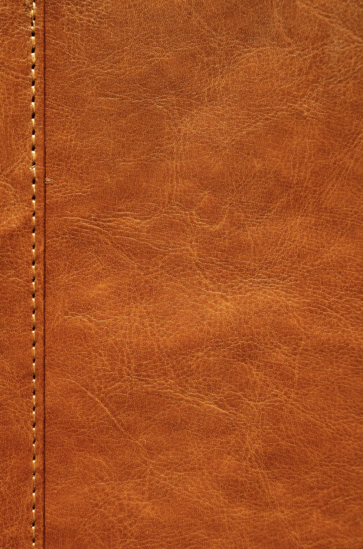 Tan leather with a stitched seam