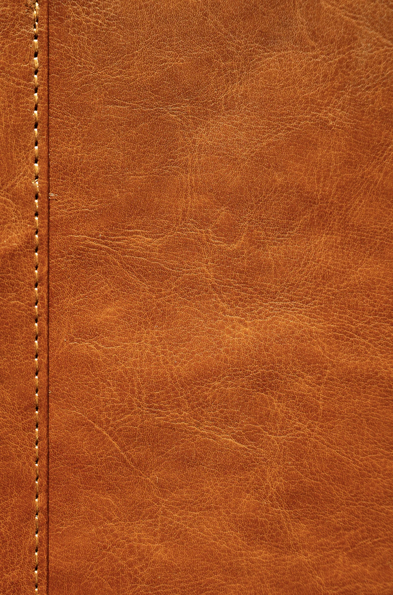 Macro shot of aged brown leather grain