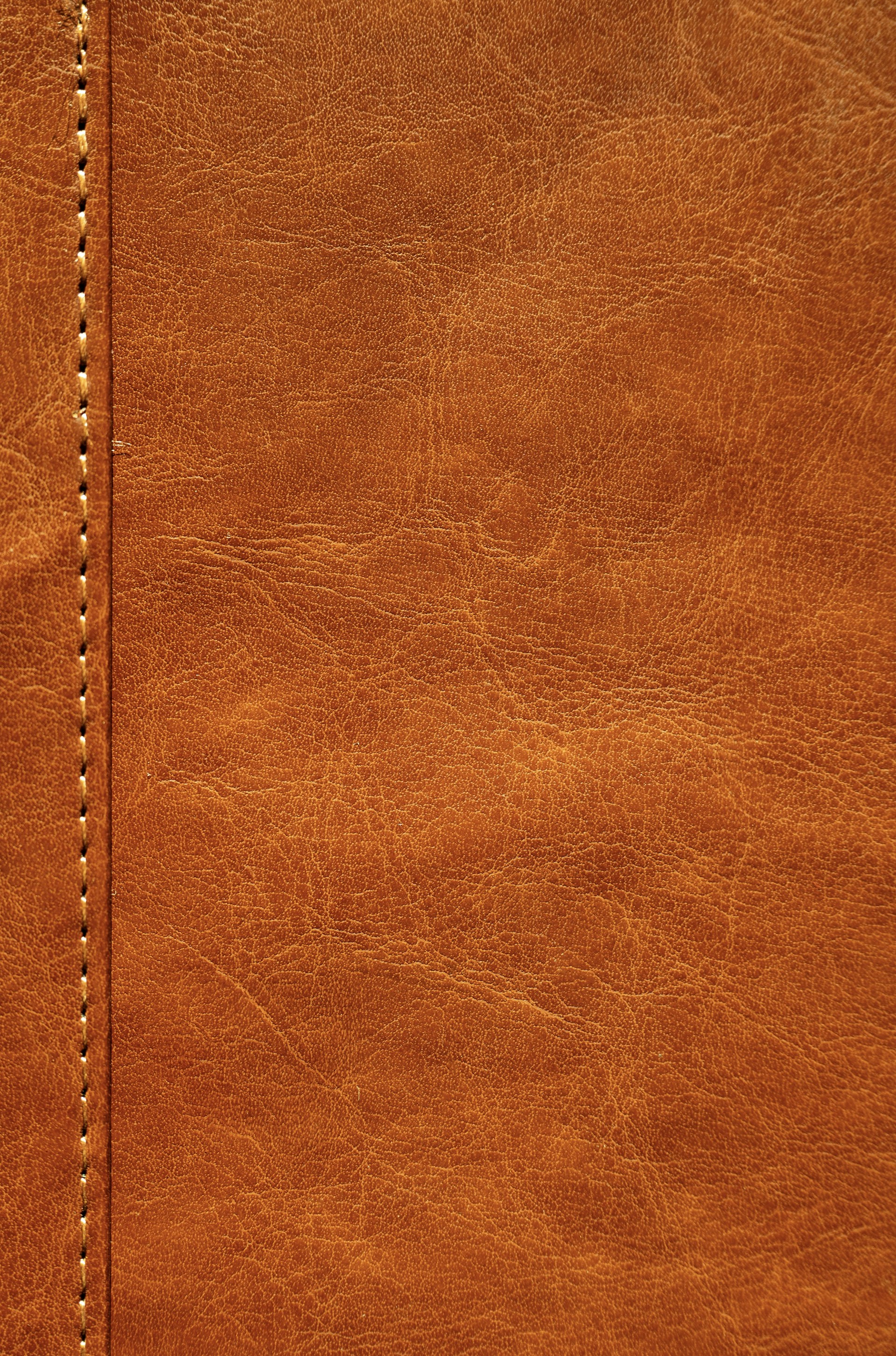 a close up of a brown leather texture