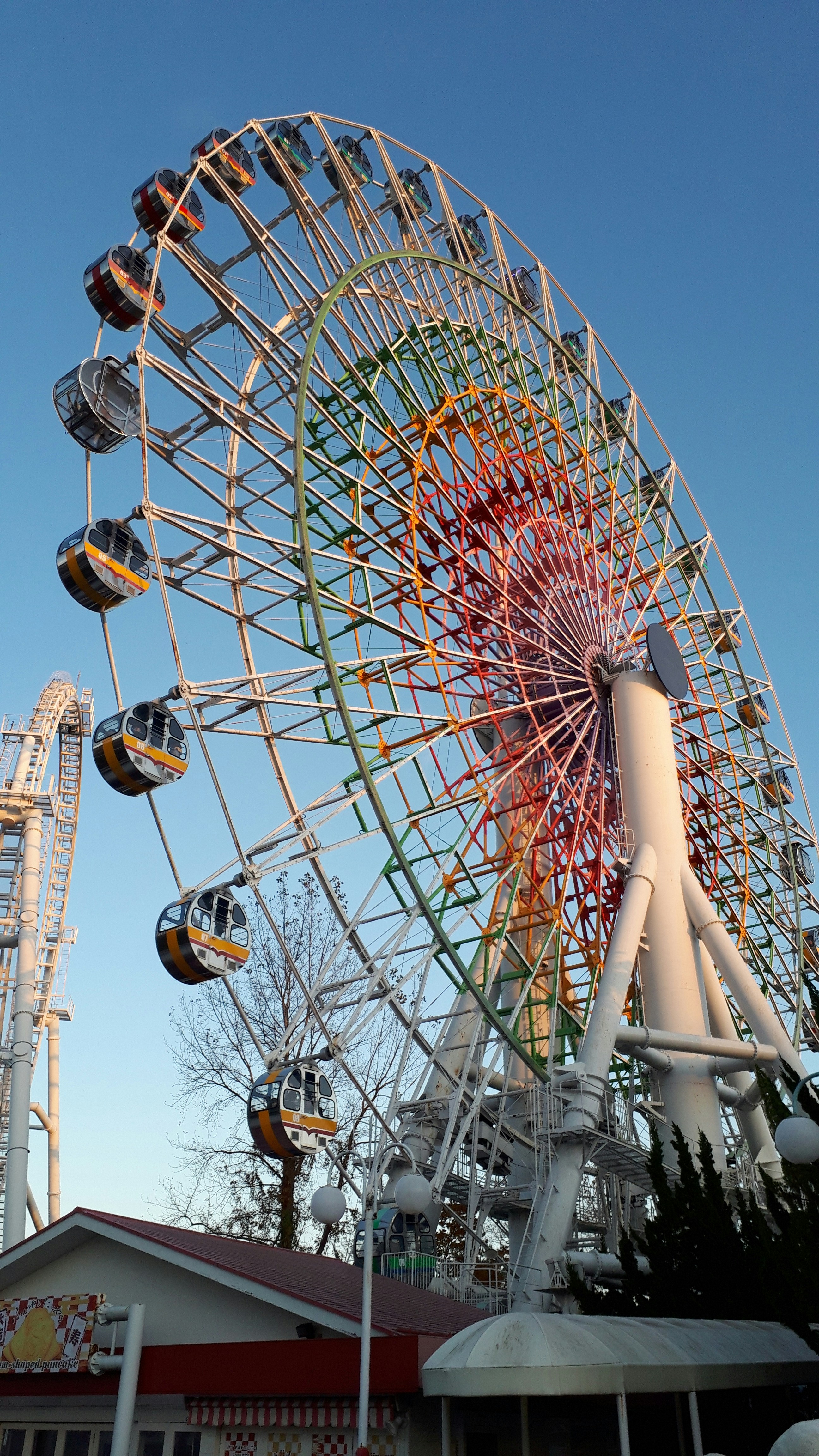a large ferris wheel sitting next to a building