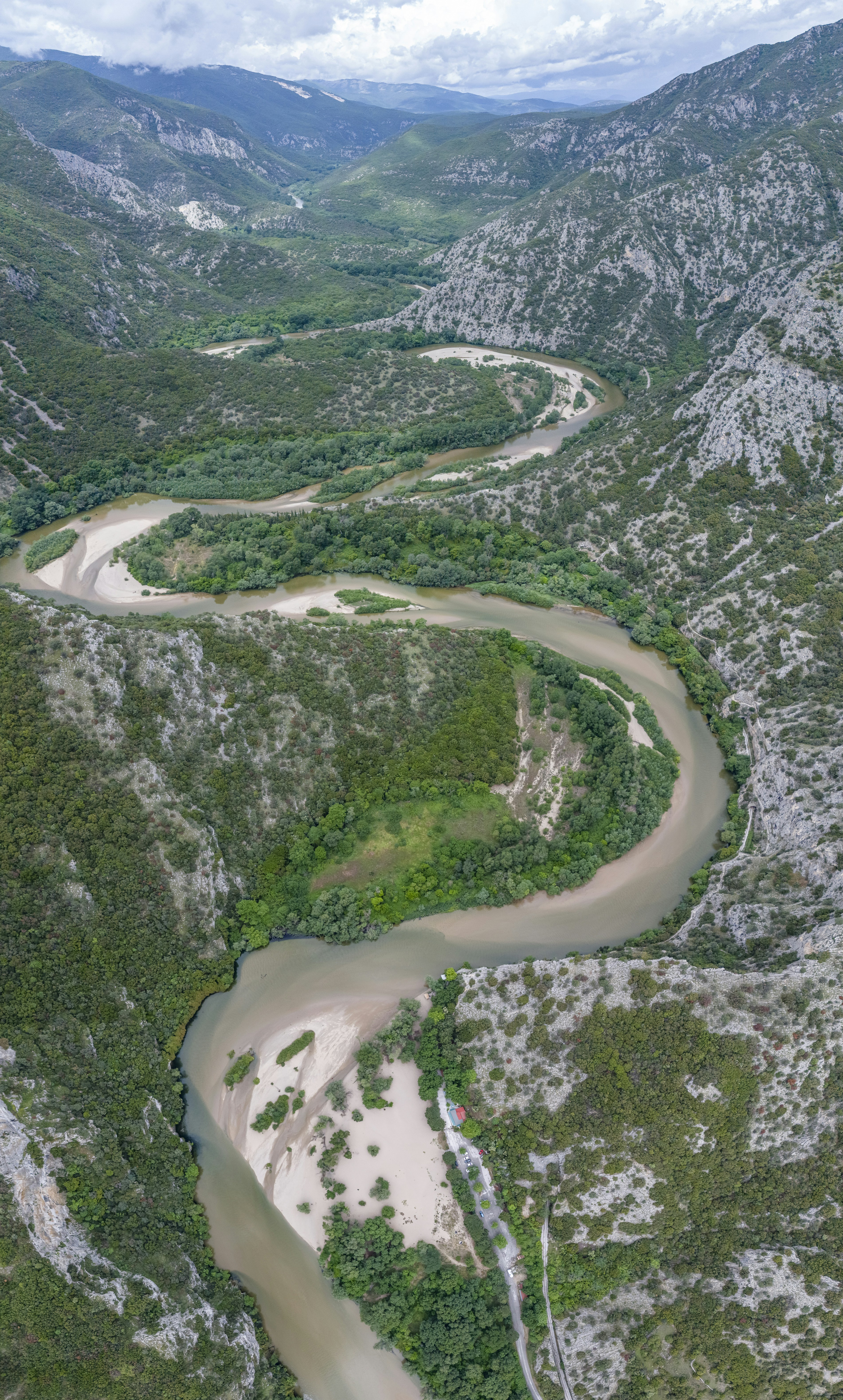 a river running through a lush green valley