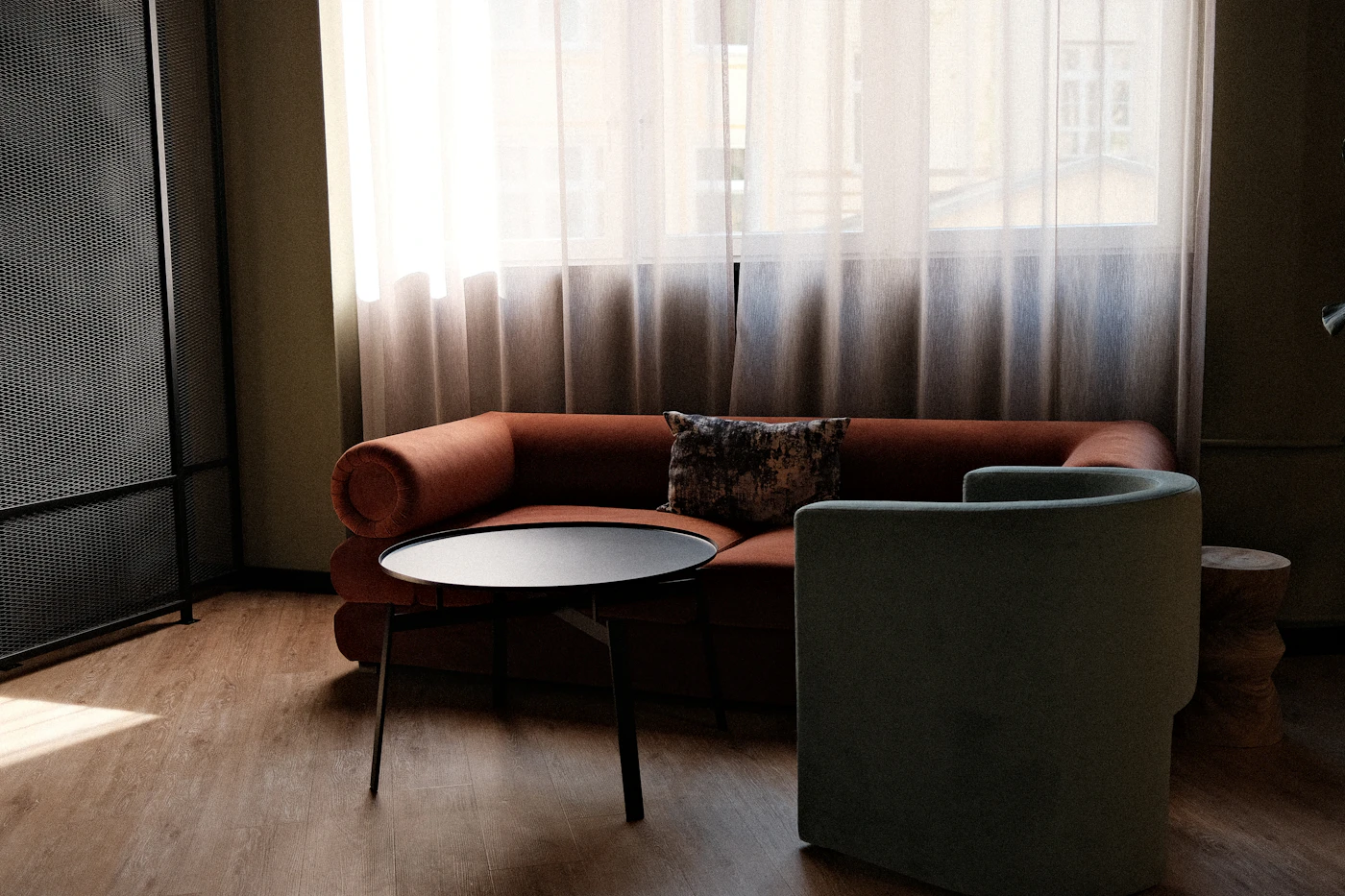 A small couch and armchair in a counselling office