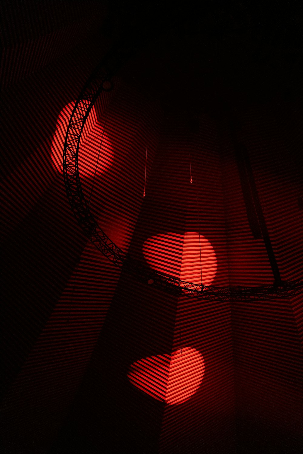 a red light is shining on a black background