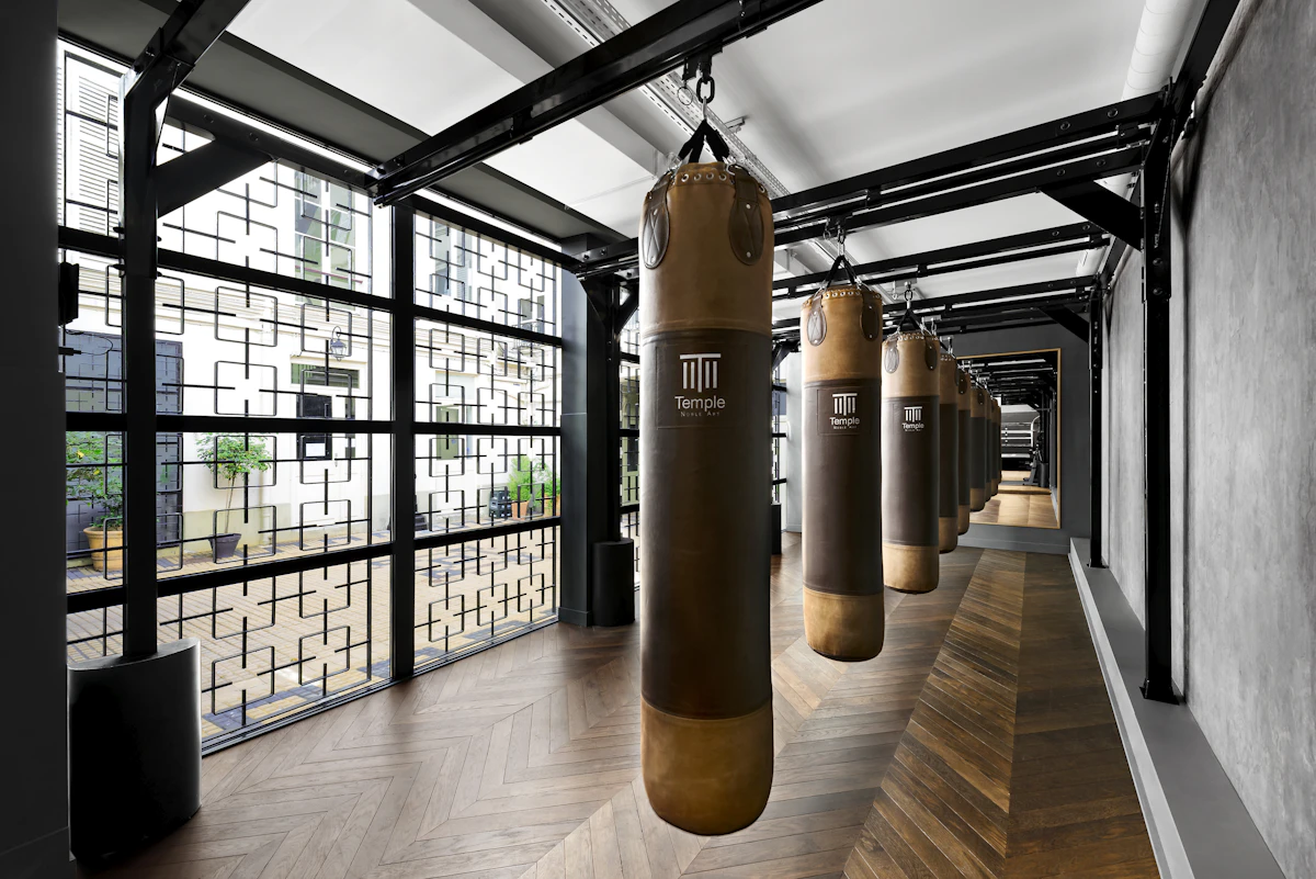 Row of punching bags inside the Spartan Boxing gym