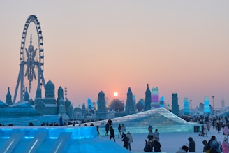 a group of people standing around an ice sculpture