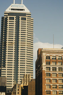 a tall building with a sky scraper in the background