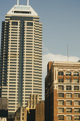 a tall building with a sky scraper in the background