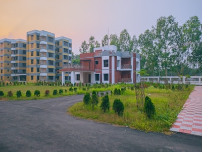 a large building with a lot of trees in front of it