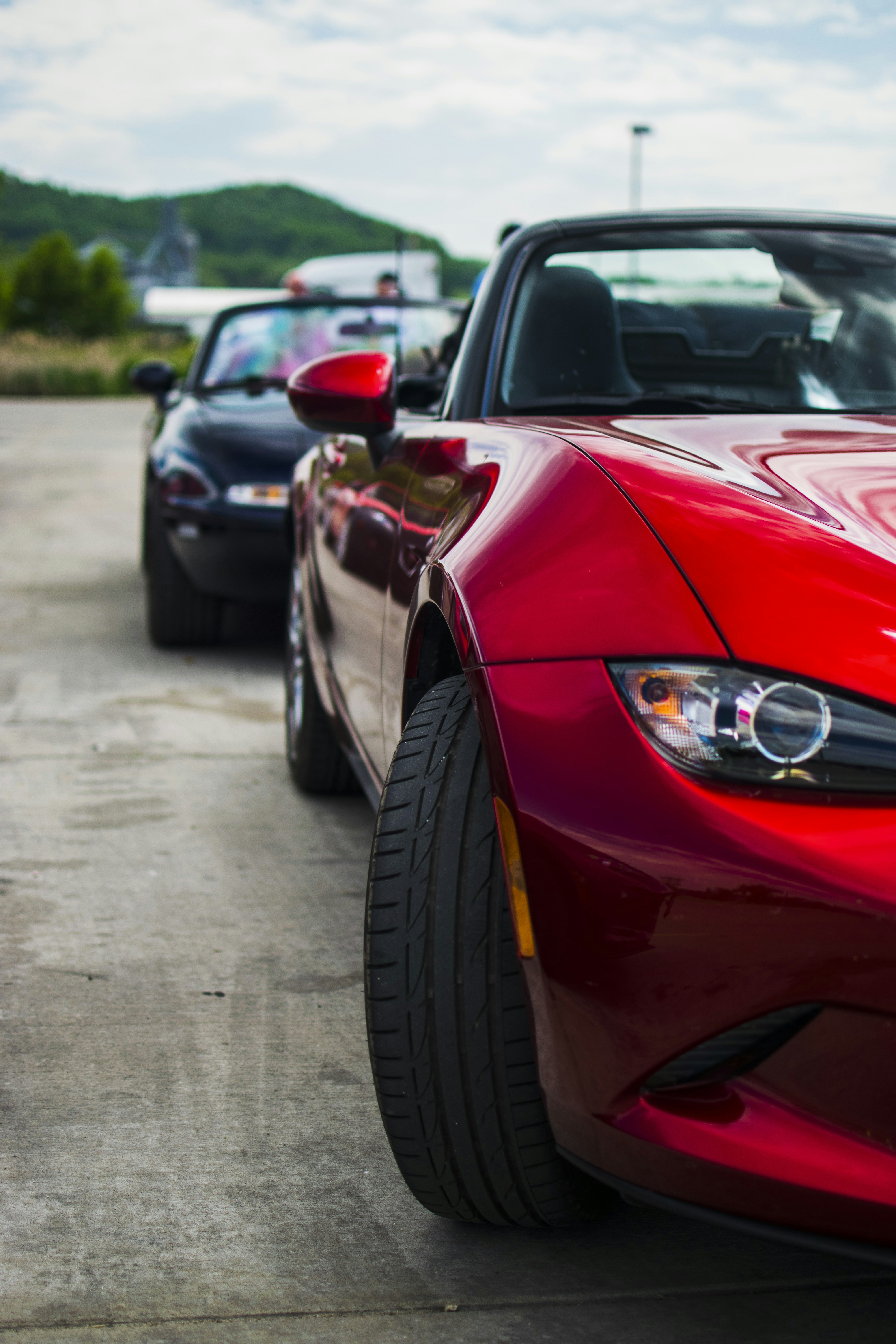 a red sports car parked in a parking lot