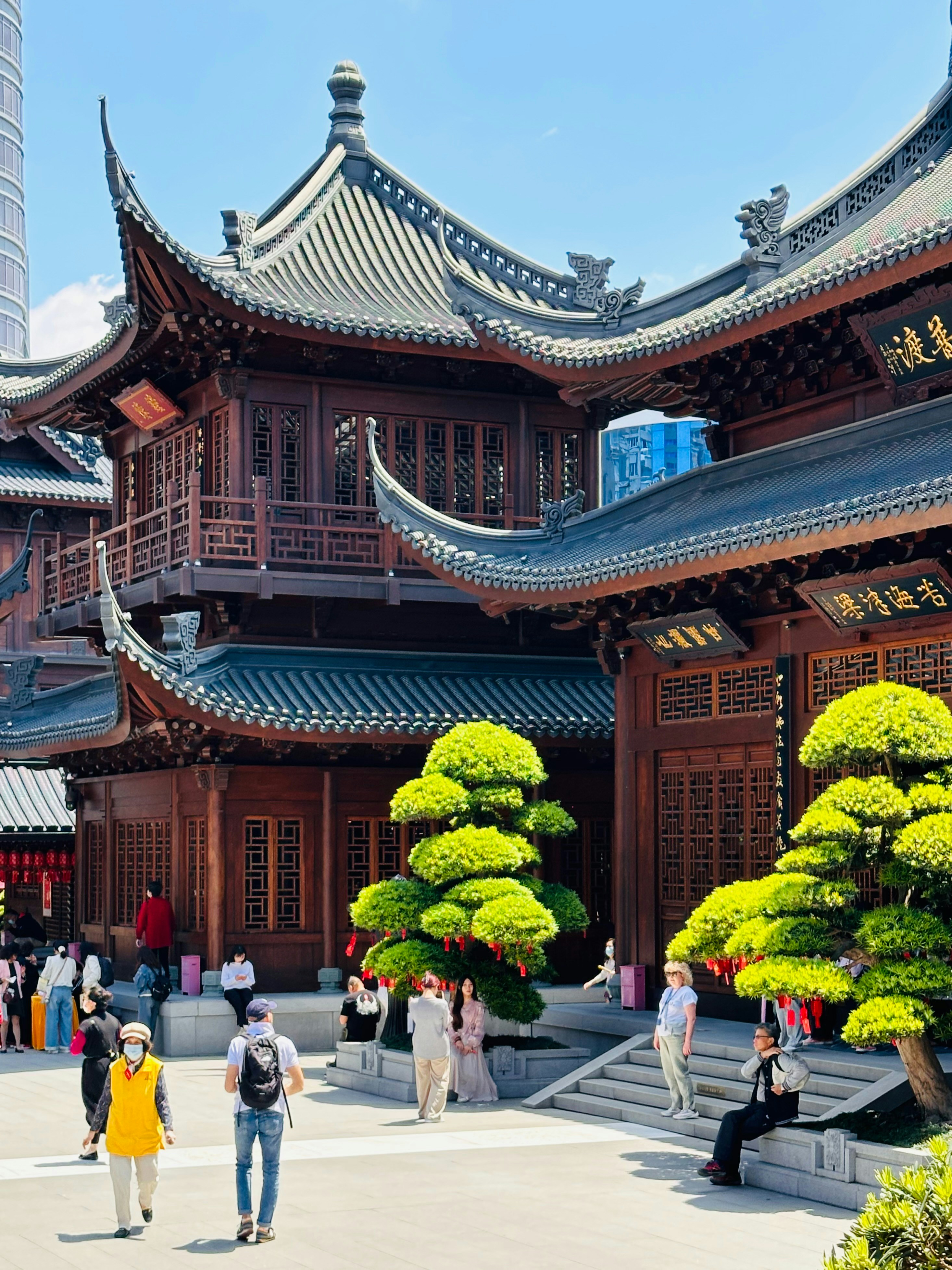 a group of people walking in front of a building