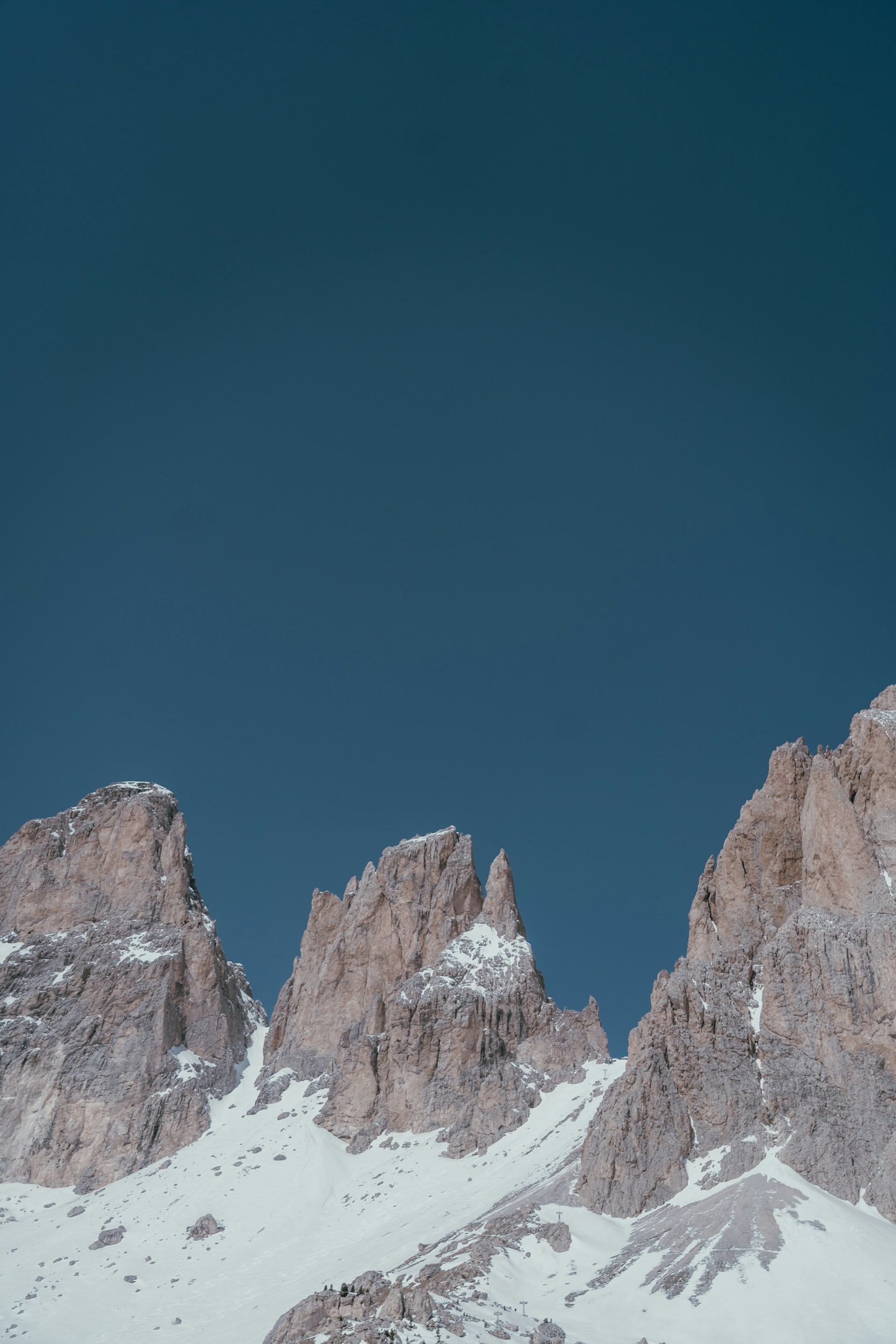a man riding skis on top of a snow covered slope