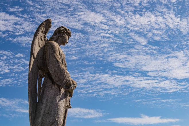 a statue of an angel with its wings spread