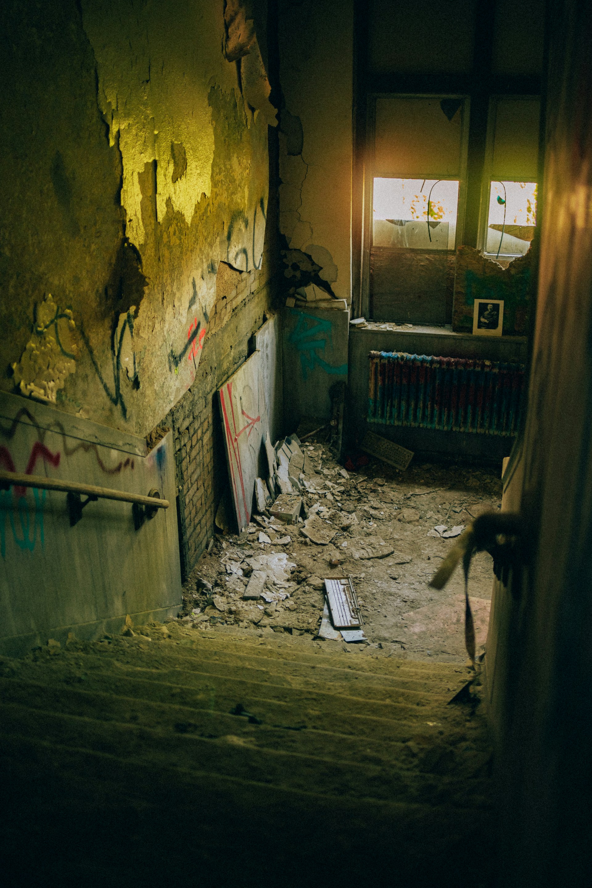 a run down room with graffiti on the walls