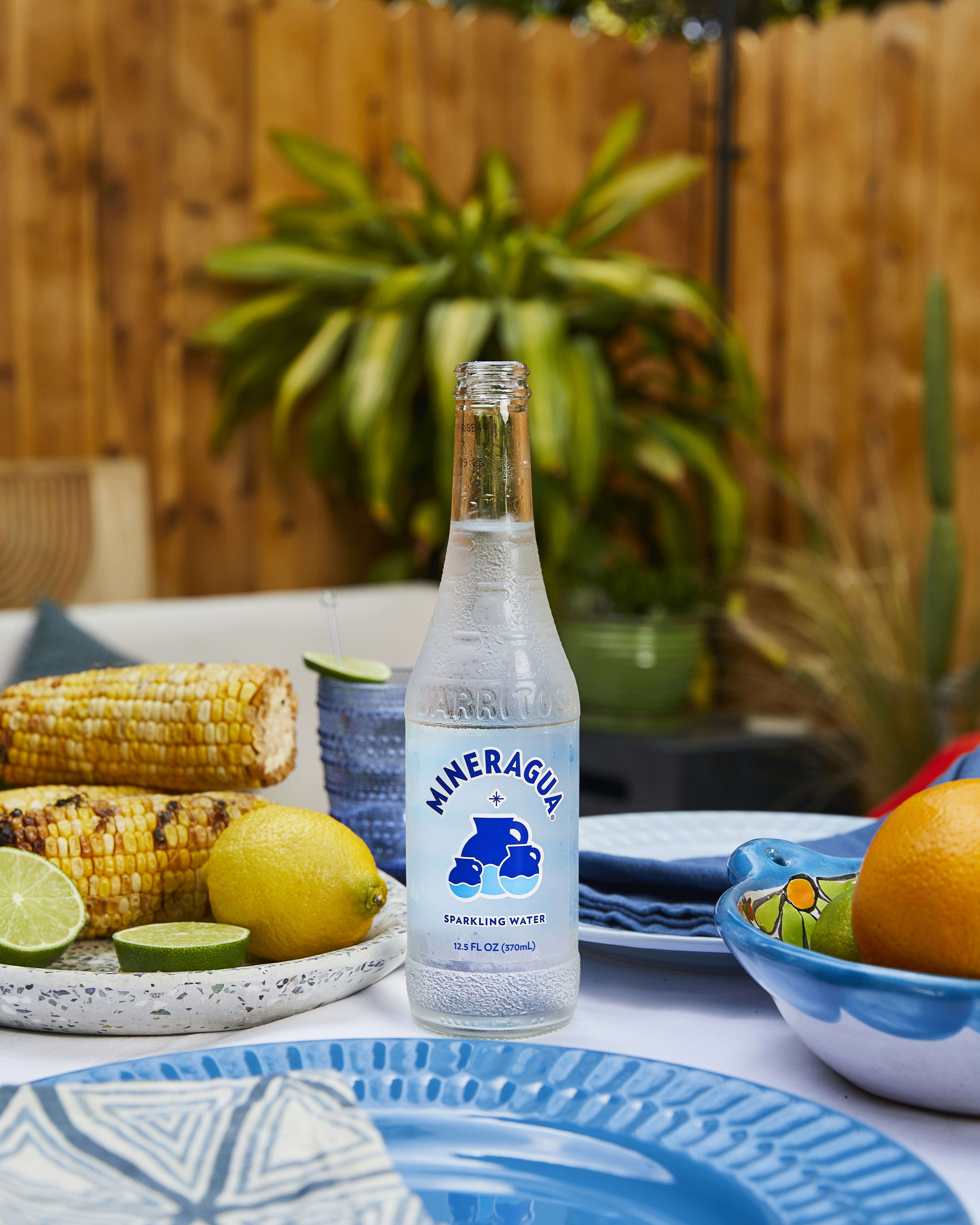 A bottle of water sitting on top of a table photo – Free Fun in the sun ...