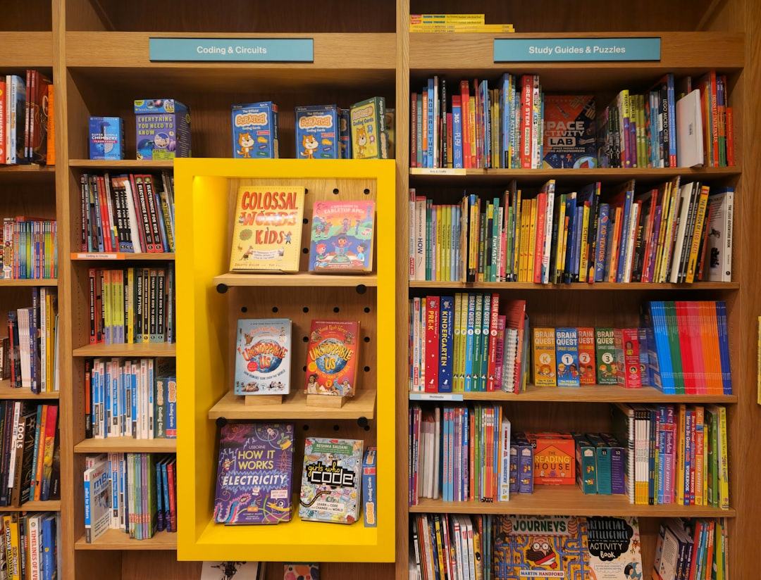 a book shelf filled with lots of books, Kid