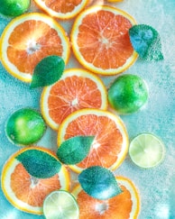 a bunch of oranges and limes on a table